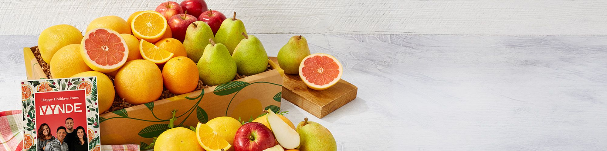 Corporate fruit gift box with a personalized company greeting card